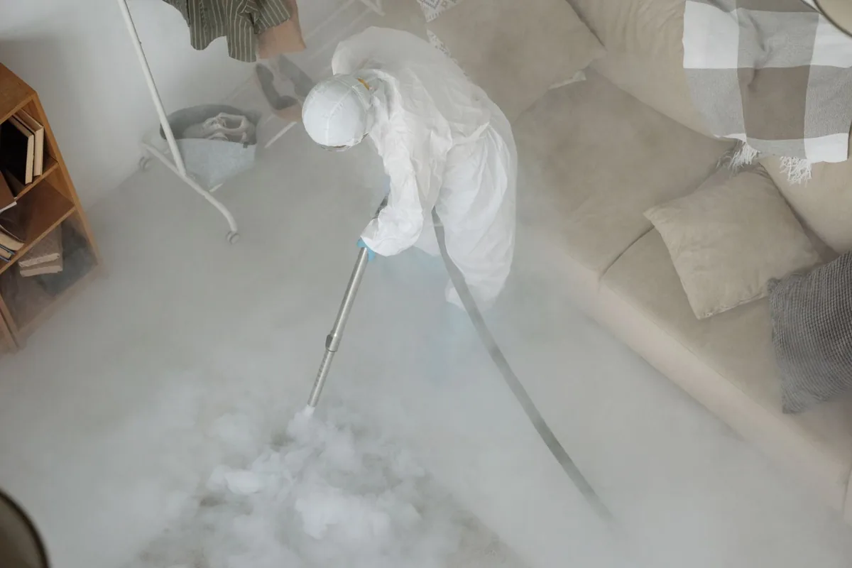 Biohazard cleanup technician in protective equipment, Villisca, IA